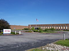 Former manufacturing facility in Henrietta, New York, constructed in the 1960s and sold to Harris RF Communications in 2010