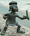 Image 39Statue of Minnie the Minx, a character from The Beano. Launched in 1938, the comic is known for its anarchic humour, with Dennis the Menace appearing on the cover. (from Children's literature)