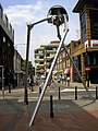 Image 32Statue of a tripod from The War of the Worlds in Woking, England, the hometown of author H. G. Wells. The book is a seminal depiction of a conflict between mankind and an extraterrestrial race. (from Culture of the United Kingdom)