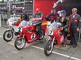 Winners Presentation 350 cc Junior Classic Race – Ian Moore (9), Chris Palmer (2) & Chris Swallow (17) TT Grandstand Tuesday 28 August 2012