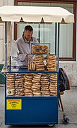 A street vendor in Kraków, Poland, selling pretzels, as well as obwarzanki krakowskie and bagels