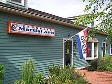 Front of the ZenQuest Martial Arts Center building in Lenox Commons