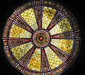 The stained glass window in the dome ceiling