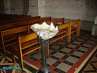 Stoup in the form of a shell in the Basilica at Notre Dame de Lorette