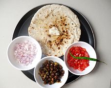 Chapati served with various sides and topped with butter