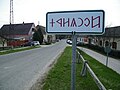 Rovas city limit sign near the pontoon bridge, featuring Hungarian runes