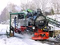Steam engine 99 785 at the water crane in the Cranzahl station