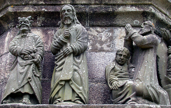On the left is a depiction of Satan tempting Jesus and offering him bread. He has lifted his cloak and we can see his cloven feet. On the right is Jesus praying in the garden of Gethsemane. The apostle St John is fast asleep at his feet, his head cupped in his left hand. All the sculpture here is by Bastien Prigent although Yan Larhantec re-sculpted Satan's head.[4]