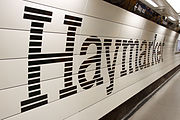 A platform at Haymarket, branded in the new corporate colour scheme.