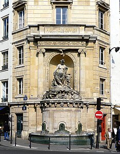 Neoclassical reinterpetation of the Ionic order, with acanthuses just above the base and ram horn-shaped volutes, of the Fontaine Cuvier, Paris, designed by Alphonse Vigoureux and sculpted by Jean-Jacques Feuchère and Pierre-Jules Pomateau, 1840-1846