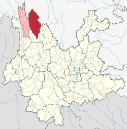 Location of Shangri-La (red) in Diqing Tibetan Autonomous Prefecture (pink) within Yunnan