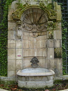 Fontaine de L'Abbaye de Saint-Germain-des-Pres, (1714-1717) built by Victor-Thierry Sully and Jean Beausire, near the church of Saint-Germain-des-Prés. originally at Rue Childebert and Rue Saint-Marguerite. It was moved in the 19th century to make room for the Boulevard Saint-Germain, and now is in Square Langevin, in the 5th arrondissement, against the wall of the former Ecole Polytechnique.