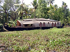 Houseboat in the midst of weeds in the backwaters