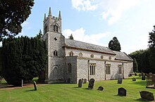 A stone church with a Gothic tower