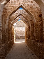 A series of stone arches in a fort