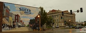 Livingston County Courthouse with mural depicting the community being the home of sliced bread. The district around the courthouse is on the National Register of Historic Places.