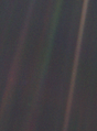 Image 6 Pale Blue Dot Photo credit: NASA/JPL Pale Blue Dot is the name given to this 1990 photo of Earth taken from Voyager 1 when its vantage point reached the edge of the Solar System, a distance of roughly 3.7 billion miles (6 billion kilometres). Earth can be seen as a blueish-white speck approximately halfway down the brown band to the right. The light band over Earth is an artifact of sunlight scattering in the camera's lens, resulting from the small angle between Earth and the Sun. Carl Sagan came up with the idea of turning the spacecraft around to take a composite image of the Solar System. Six years later, he reflected, "All of human history has happened on that tiny pixel, which is our only home." More selected pictures