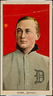 baseball card featuring a man with sleek hair, in a baseball uniform with an old English "D" in the front, looking overhead