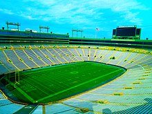 A panoramic picture of Lambeau Field with the stands empty