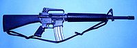M16A2 with new adjustable rear sight, case deflector, heavy barrel, and improved furniture.