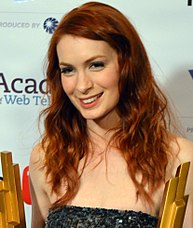 A smiling, red-haired Felicia Day