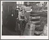 Farm boy in the general store (1938)