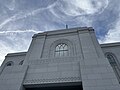 The Orem Utah Temple, showing a closeup of the stonework. Patterns show various motifs such as cherry blossoms, and an egg and dart motif.