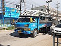 Medium-sized Isuzu Songthaew (truck bus) as seen in Samut Sakhon, Thailand.