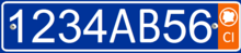 Plate with a single row of white alphanumeric characters on a blue background, and an orange bar on the right side containing the white letters CI at the bottom, and a white silhouette of the Ivory Coast inside a white circle at the top.