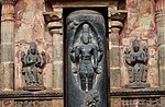 Shiva flanked by Brahma (left) and Vishnu