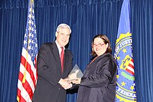 Aftab accepting an award from FBI Director Robert Mueller in 2010