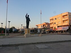 A statue of Turkish Prime Minister Bülent Ecevit at a Y-junction between Taşkınköy and G­­öçmenköy