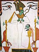 Green-skinned god wearing white and holding crook and flail