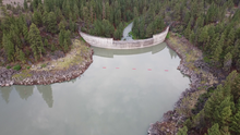 Drone image of Gerber Reservoir dam taken looking SW from the reservoir toward the dam.