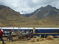 The train Belmond Andean Explorer[4] at La Raya Station with market stalls and the mountain Chimboya in the background