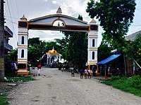 statue and entrance gate at Ramagrama stupa