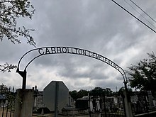 Arched iron gateway over the entrance to Carrollton Cemetery No.1 at Adams and Green Streets in New Orleans, Louisiana