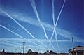 Image 18Water vapor contrails left by high-altitude jet airliners. These may contribute to cirrus cloud formation. (from Aviation)
