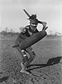 Image 44A Luritja man demonstrating method of attack with boomerang under cover of shield (1920) (from Culture of Australia)