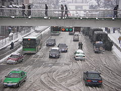 Snow blizzard in Hefei, Anhui Province, China during 2008. Of particular interest are the military vehicles parked on the roadside.