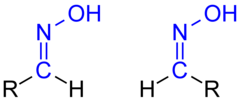 Isomerie der Aldoxime: links ein früher als syn-, heute als (E)-konfiguriert zu beschreibendes Aldoxim, rechts das entsprechende (Z)- (veraltet: anti)-Isomer.