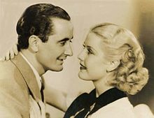 still frame from movie depicting Nino Martini and Anita Louise