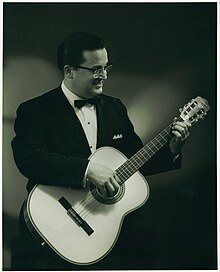 Tony Bradan in 1968, playing classical guitar