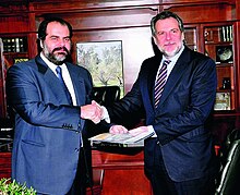 Nikolas D. Pateras hands over a check of 200,000 euros for the repair of DI.AS and D.EL.TA motorcycle teams of the Hellenic Police to the Minister of Citizen Protection Christos Papoutsis (2011)