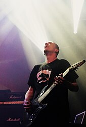 Justin Broadrick playing a seven-string guitar with Godflesh