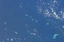 Photograph of the South China Sea taken aboard the International Space Station, showing Taiping Island and surrounding features.