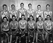 Group photograph of basketball players, some standing and some sitting