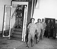 Three of the indicted Japanese war criminals are led to their cells underneath the Supreme Court in Singapore