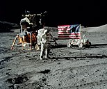 Gene Cernan saluting, in front of the Lunar Module and Lunar Roving Vehicle