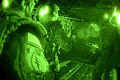 Special Forces Soldiers with the Illinois National Guard's Company A, 2nd Battalion, 20th Special Forces Group (Airborne) in Chicago, prepare for a night high altitude high opening jump at 14,000 feet from a CH-47D Chinook with Company B, 2nd Battalion, 238th Aviation Regiment in Peoria, Illinois, at Fort McCoy, Wisconsin, August 8.